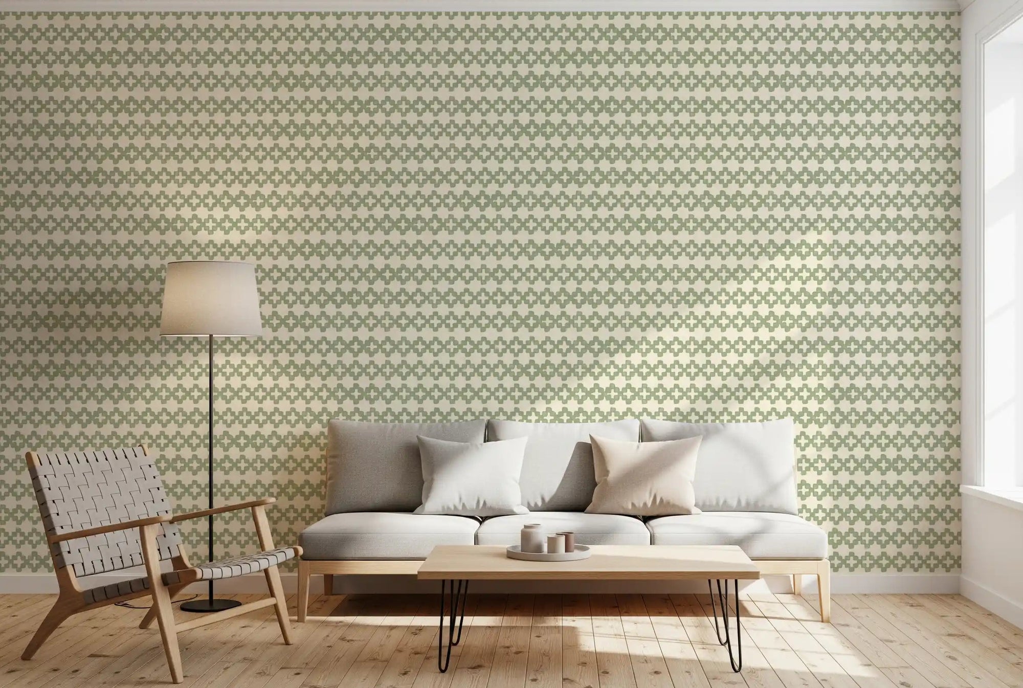 Living room calmed by Zellige Cross Ornament coastal green wallpaper in daylight.