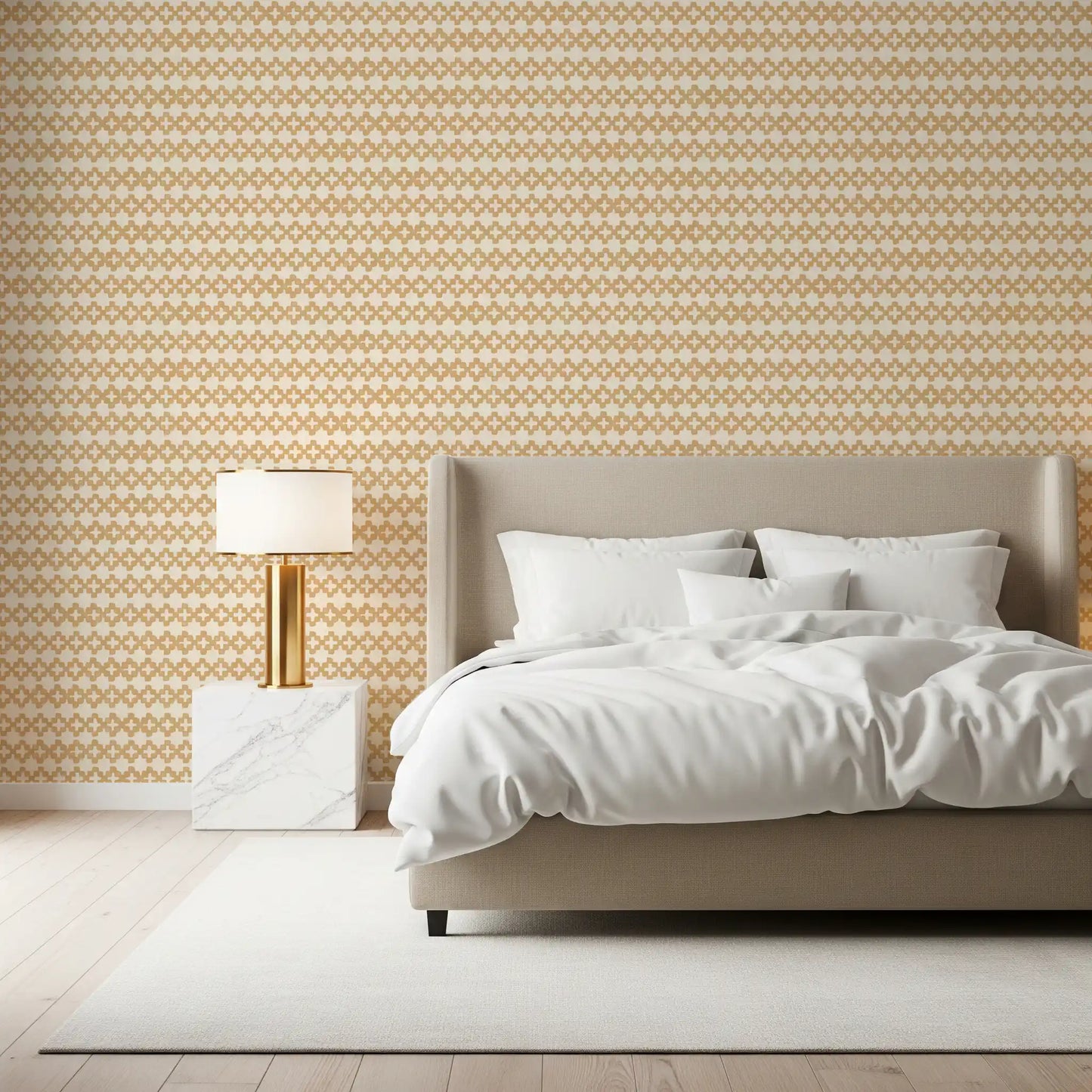 Warm ochre and off-white give the Zellige Cross Sand wallpaper its calm palette.