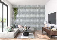 Slate blue zellige wallpaper giving the living room a calm, tiled rhythm