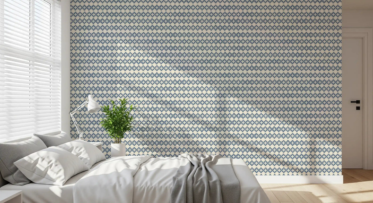 Slate blue zellige cross ornament wallpaper on a warm cream ground