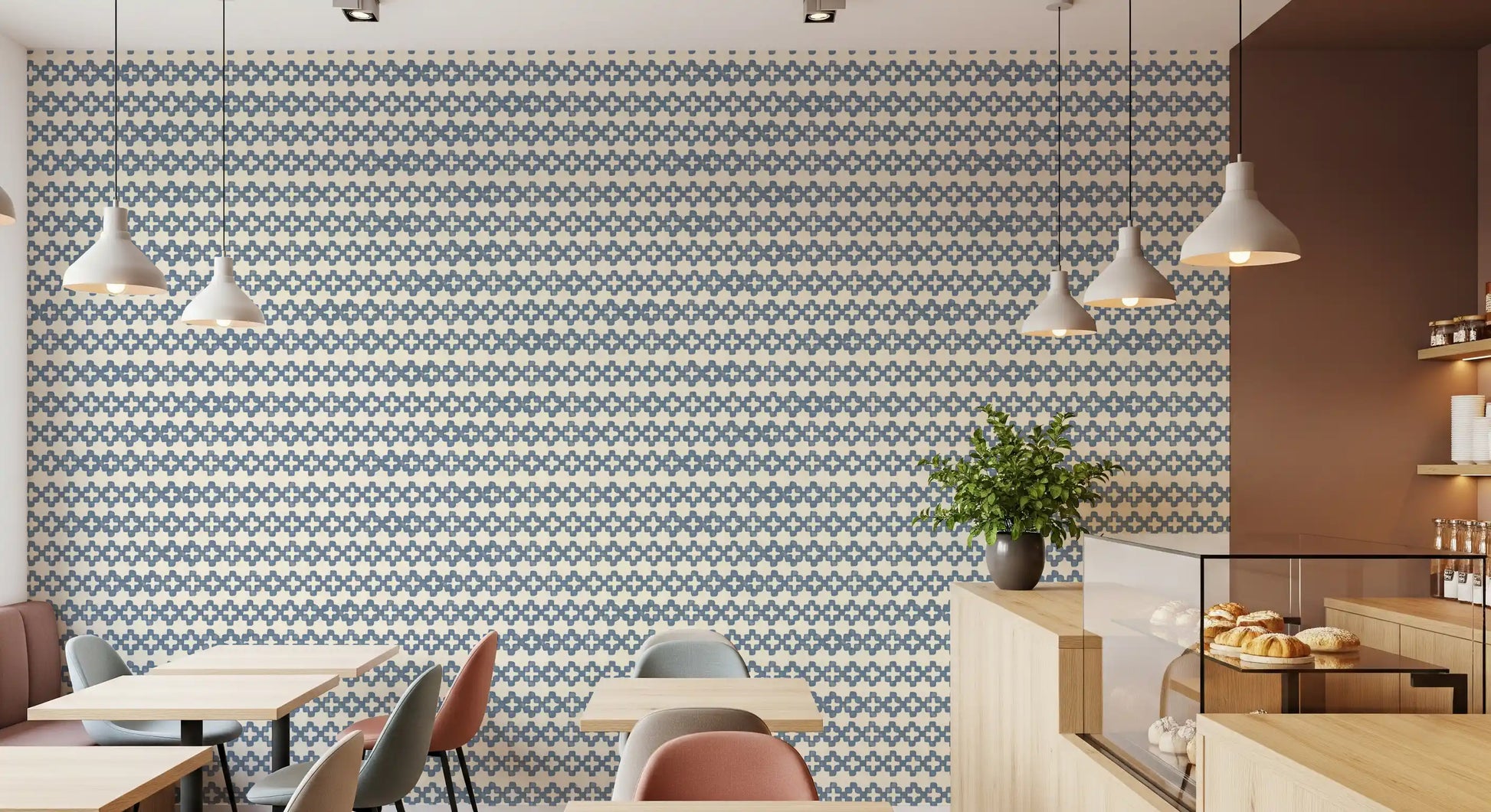 Zellige wallpaper showing slate blue crosses, cream gaps, and a tiled repeat