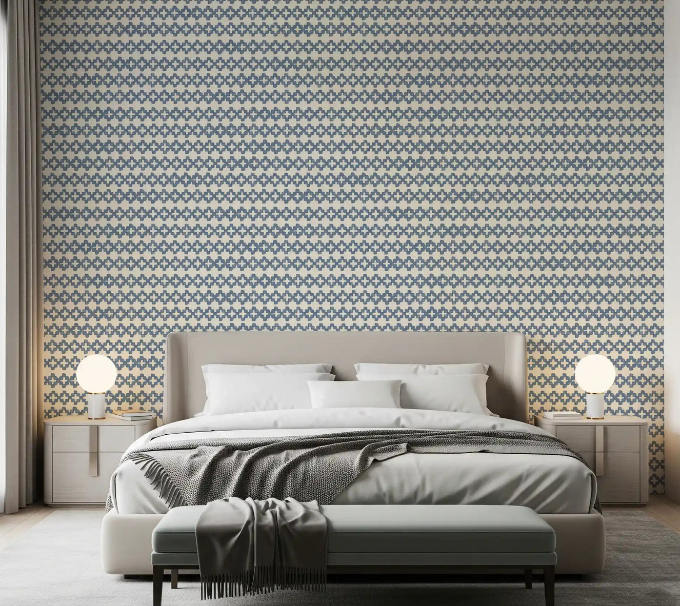 Bedroom dressed in slate blue zellige cross wallpaper over a creamy ground