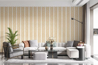 A warm sand palette lifts this Living room with zellige striped wallpaper.