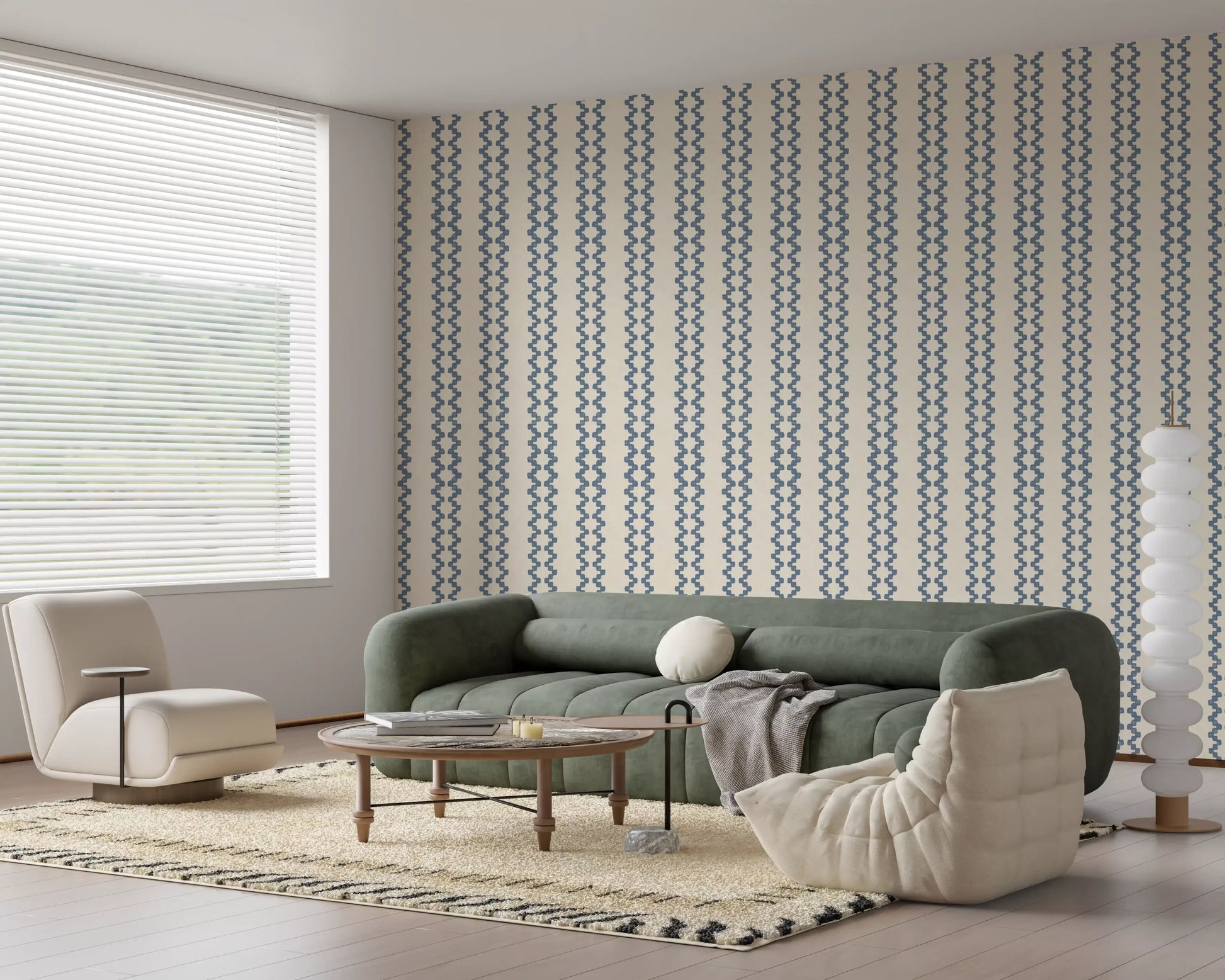 Living room dressed in zellige striped wallpaper in muted slate blue and cream