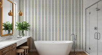 Vertical chains of slate blue motifs run down this zellige striped wallpaper