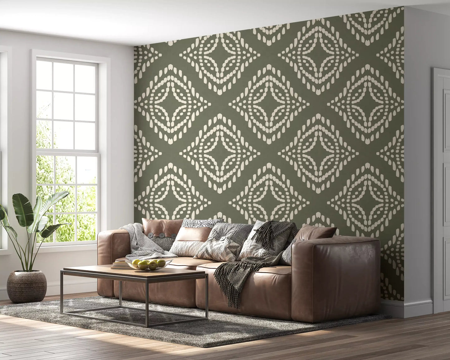 Geometric boho wallpaper in palm green steadies a bright sitting room
