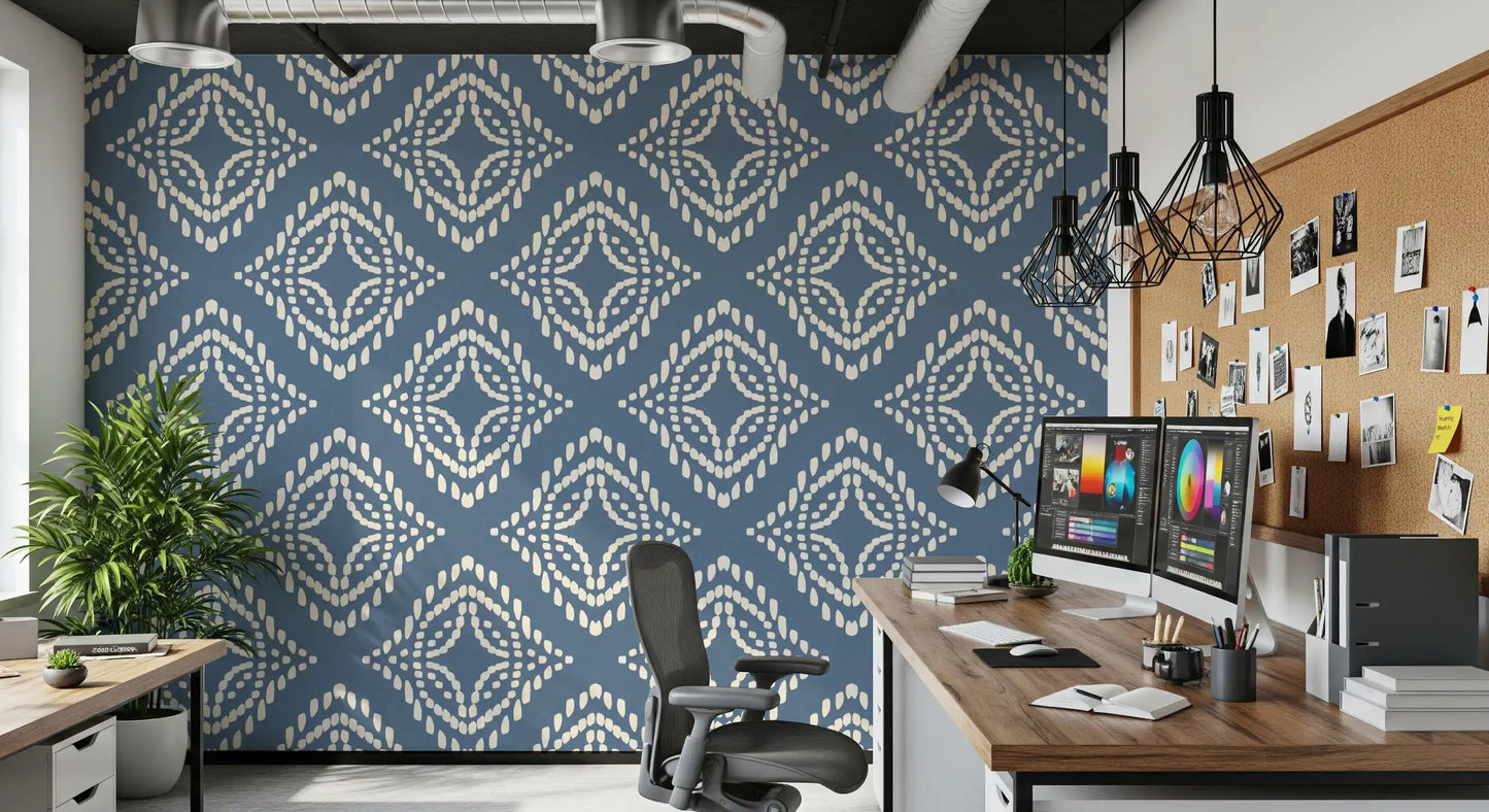 Ivory beadwork spreads outward in even rings on this slate blue ornament wallpaper
