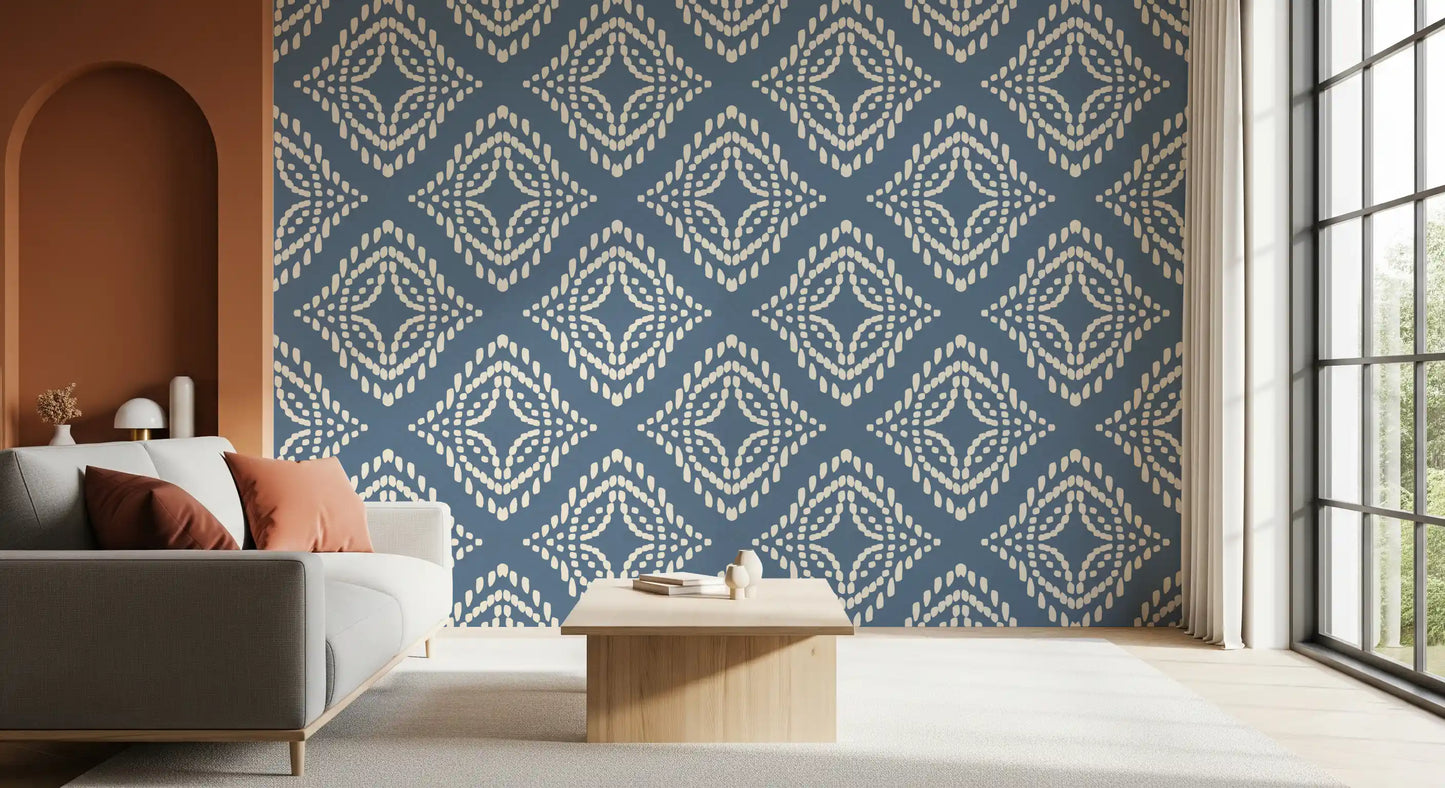 Nested diamonds set a rich block print canvas wallpaper across this lounge