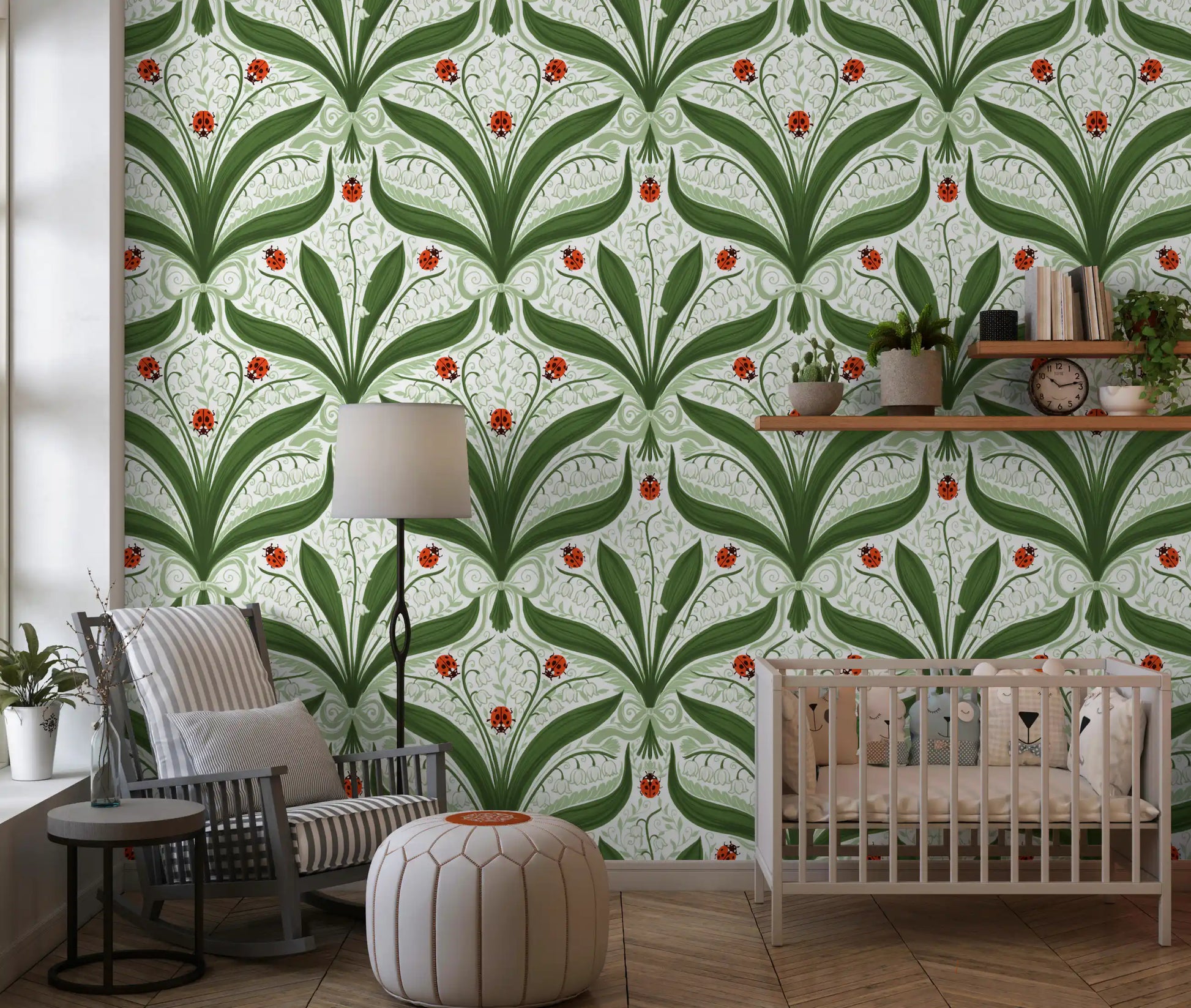 Bright ladybug motifs punctuate the green and ivory lily valley wallpaper