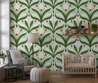 Bright ladybug motifs punctuate the green and ivory lily valley wallpaper