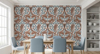 Two squirrels climb oak boughs above the central owl on this wallpaper