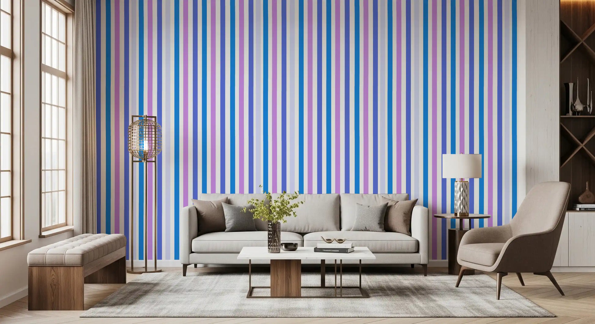 Lounge area accented by blue and lilac vertical stripe wallpaper overhead