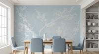 Misty white branches quiet a Dining room in this Blossom Silhouette wall mural.