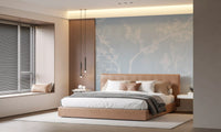 White branches and pale blue haze dress an Bedroom in Blossom wall mural.