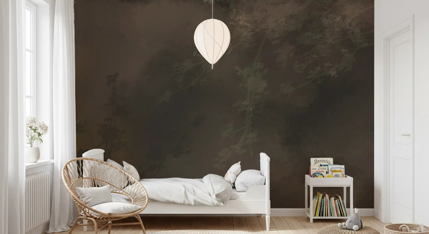 Faded branches and fog quiet the bedroom in this moody wall mural