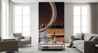 Glowing ring of light leads down a hallway in the Night Spin wall mural