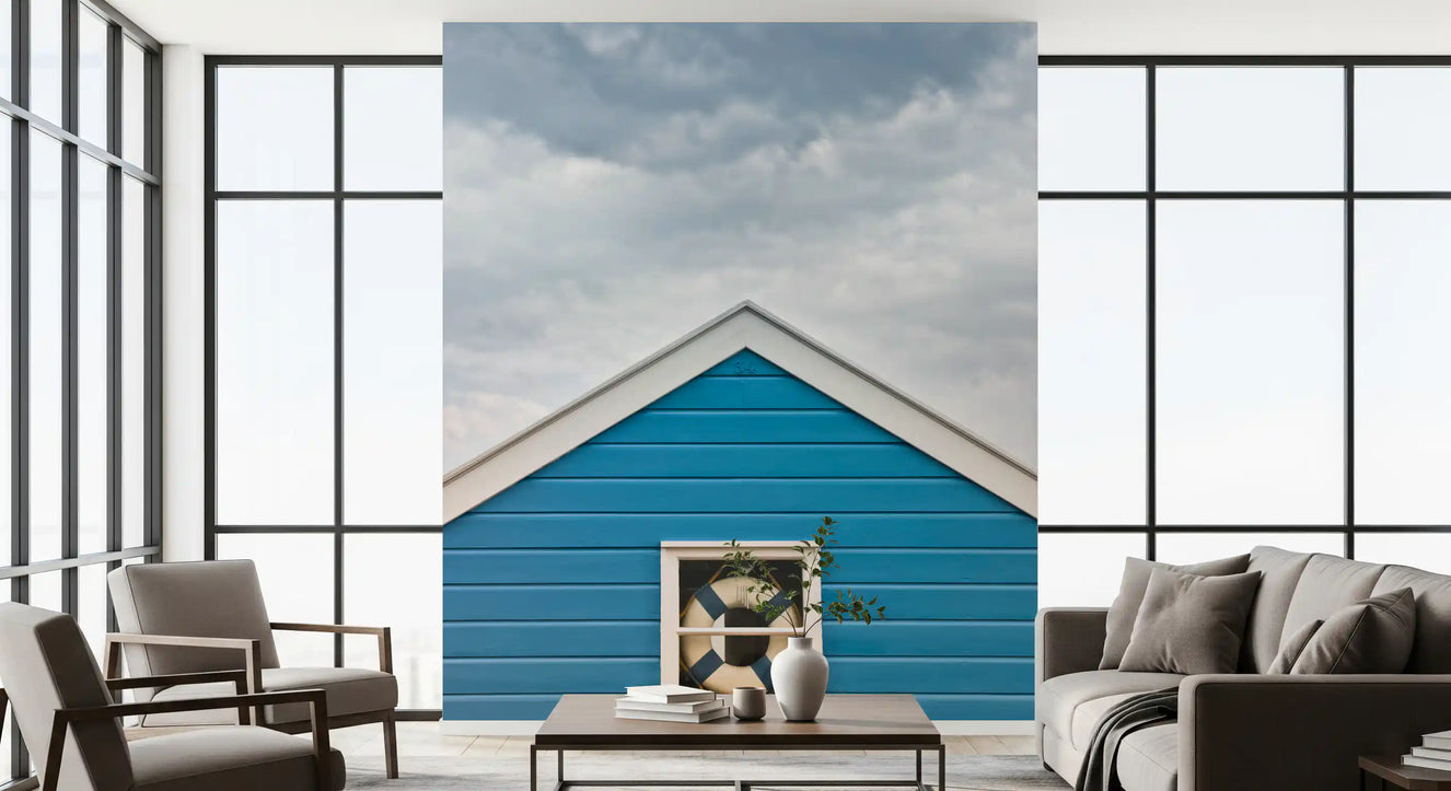 Breezy coastal mood fills a living room with the Blue Beach Hut wall mural
