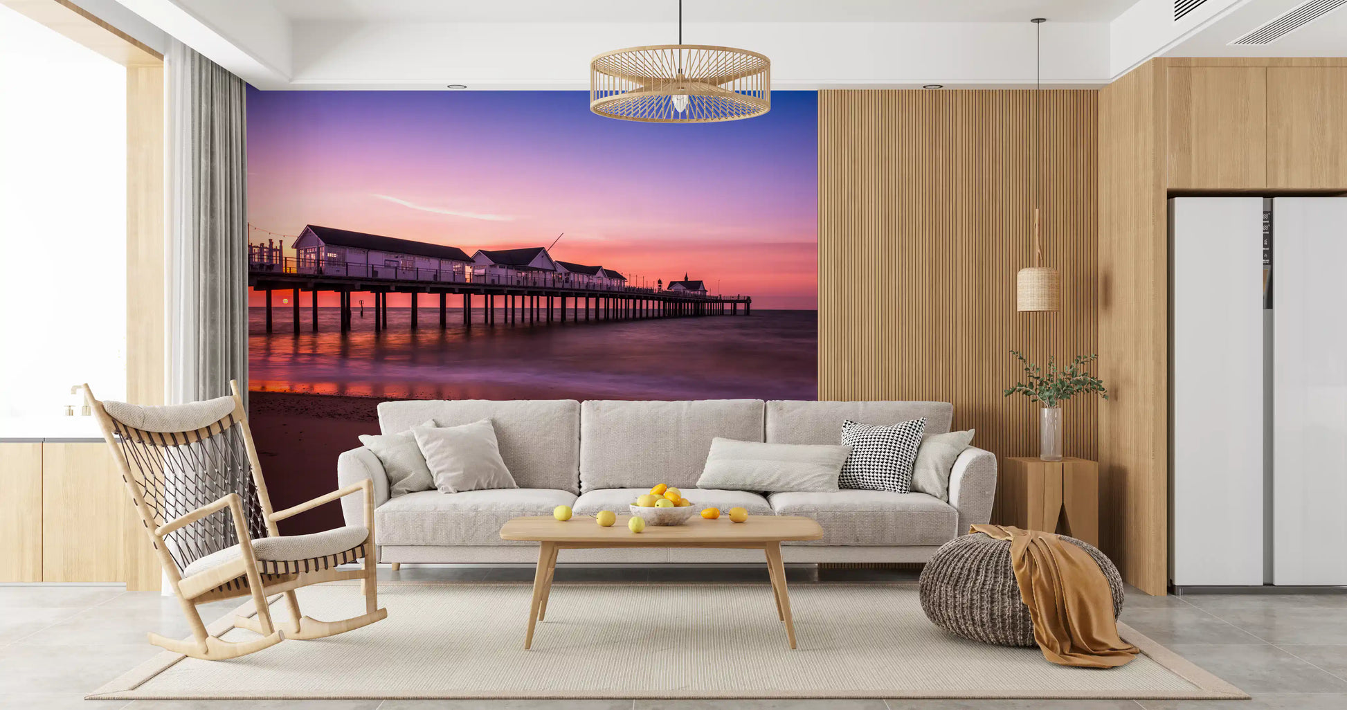 Living room carrying the calm violet glow of the Pier Reverie wall mural.