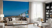 Pink, blue and white fronts catch the light in this Colorful Beach Hut wall mural