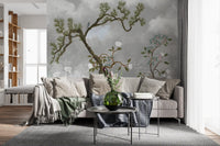 Living-room view shaped by a clouded pine and bloom wall mural
