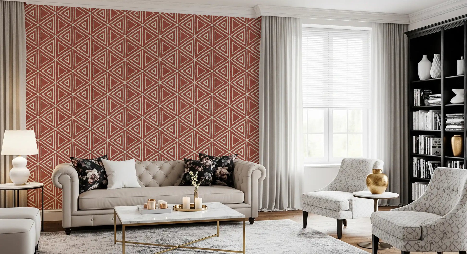 Cream-on-rust triangle mudcloth wallpaper behind a small Living nook