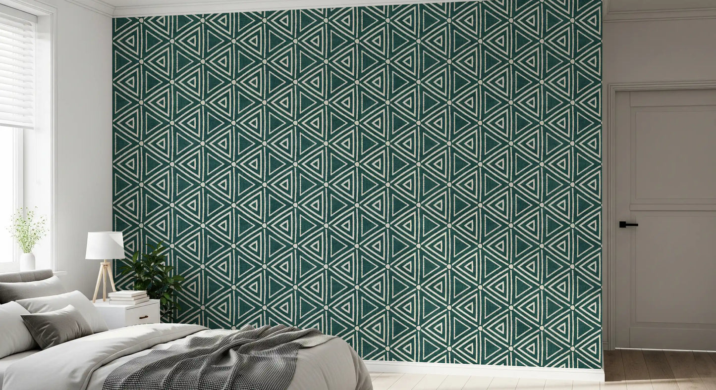 Set against cream tones, the Mudcloth Geometric wallpaper grounds a relaxed bedroom 