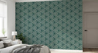 Set against cream tones, the Mudcloth Geometric wallpaper grounds a relaxed bedroom 