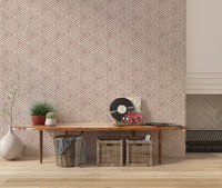 Geometric triangles patterning a quiet lounge in this boho mudcloth wallpaper