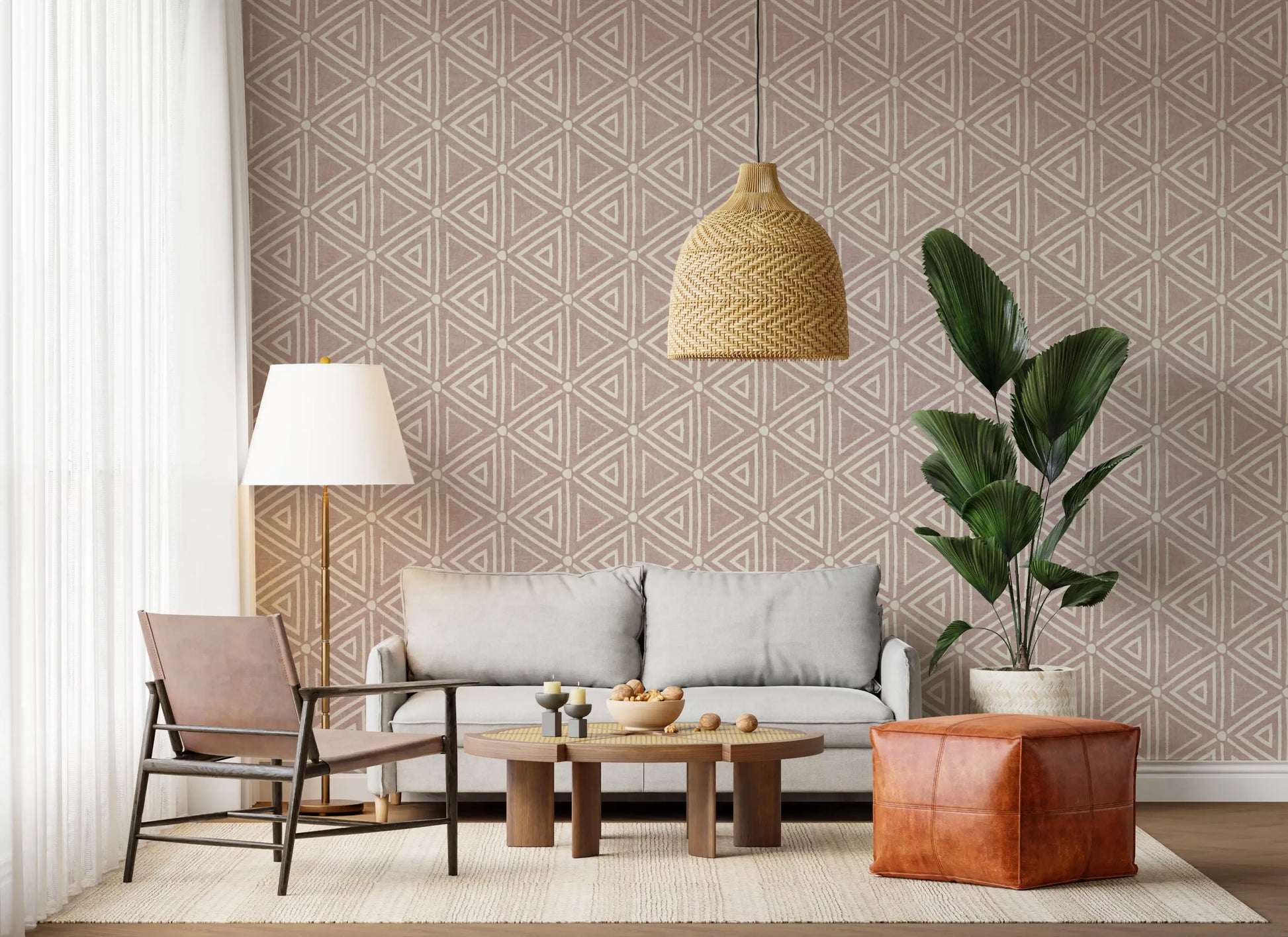 Warm rose ground meeting ivory geometry in the textured mudcloth wallpaper