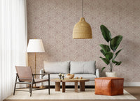 Warm rose ground meeting ivory geometry in the textured mudcloth wallpaper