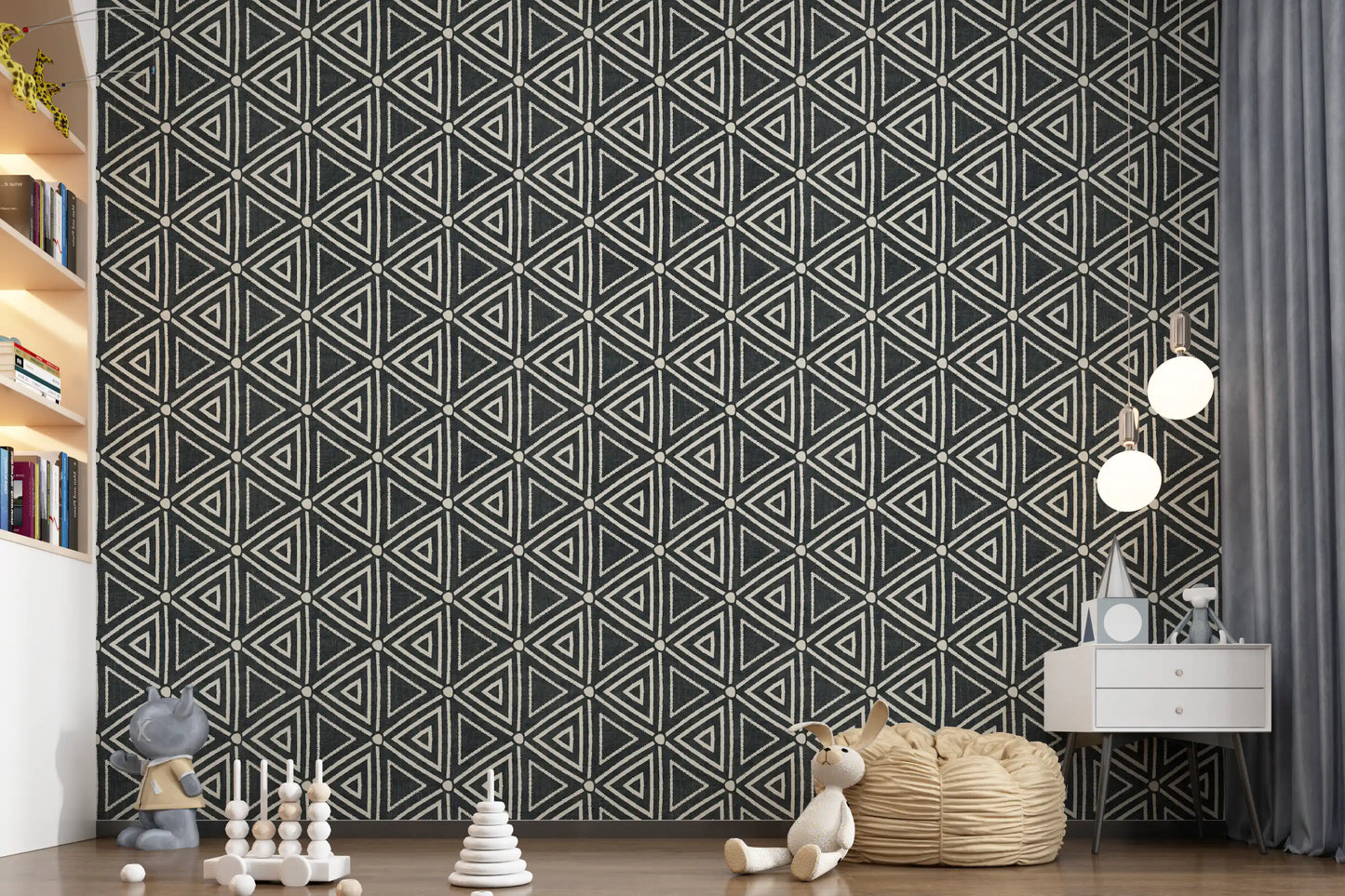 Chalky ivory shapes contrast deep black in the geometric mudcloth wallpaper pattern