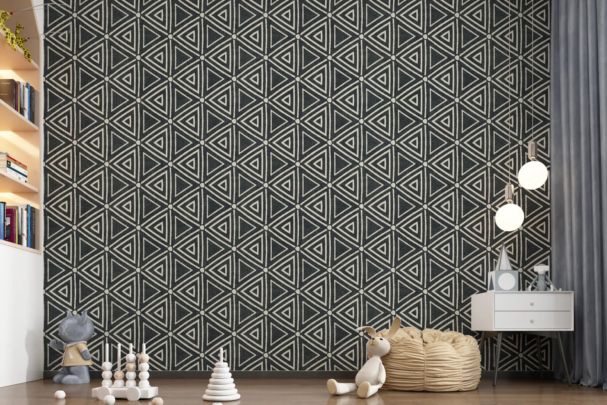 Chalky ivory shapes contrast deep black in the geometric mudcloth wallpaper pattern