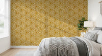 Mudcloth triangles sit in tight rows over a warm mustard wallpaper ground