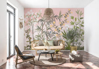 Tall painterly trees stretch up beside an open Living room wall mural