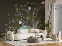 Painterly depth wraps a lounge dressed in this moody chinoiserie wall mural