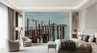 Mooring posts rise in long rows from still lagoon water in this Twilight Pier wall mural