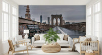 Skyline view and bridge towers stretch behind a Hallway with this Brooklyn wall mural
