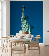 Set in a dining run, Liberty's Azure Grace wall mural shows a copper figure