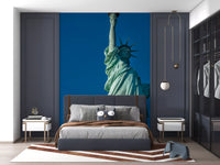 Seven crown rays and lifted torch mark the Liberty's Grace wall mural top section