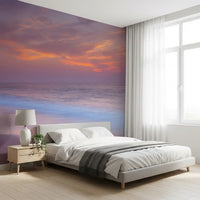 Cloud cover sits above a still sea and pale sand in the Beach Serenity wall mural.