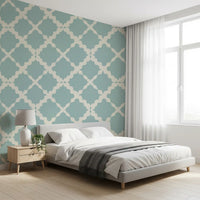 Morning light washes over this muted blue modern wallpaper inside a peaceful bedroom