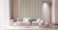 Living room showing striped wallpaper with a wooden bed frame on light floors