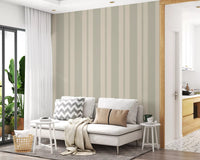 Hallway covered in a muted wallpaper showing vertical bands and dots