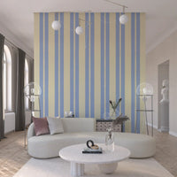 Vertical lines with a repeating wavy pattern on this sky blue wallpaper.