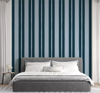 A navy striped Scallop & Dot Vertical Harmony Wallpaper⁠ lines the bedroom.