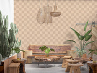 Off-kilter shapes wobble inside the dining room in muted wallpaper shades.