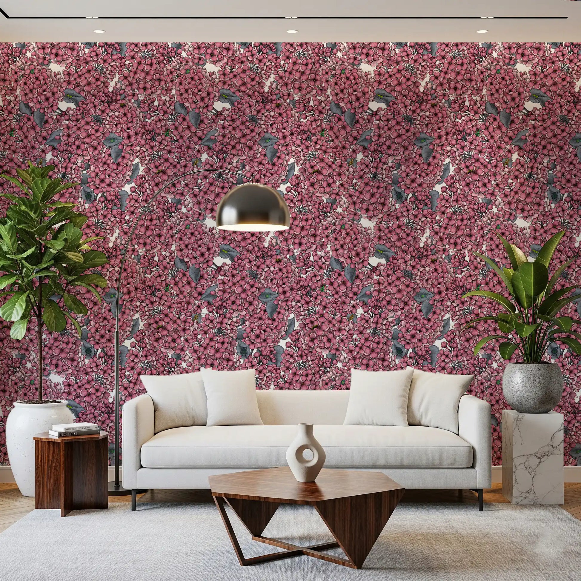 A bright Living room utilizes the bold botanical Pink Lilac wallpaper for depth.