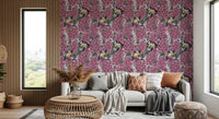 Birds rest among flowers in the Birds in pink lilac garden wallpaper.
