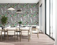 Covering dining zones, the lilac wallpaper brings a fresh botanical aesthetic.