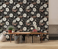 White moonflowers pop against the dark Moonflowers and sphinx moths wallpaper.